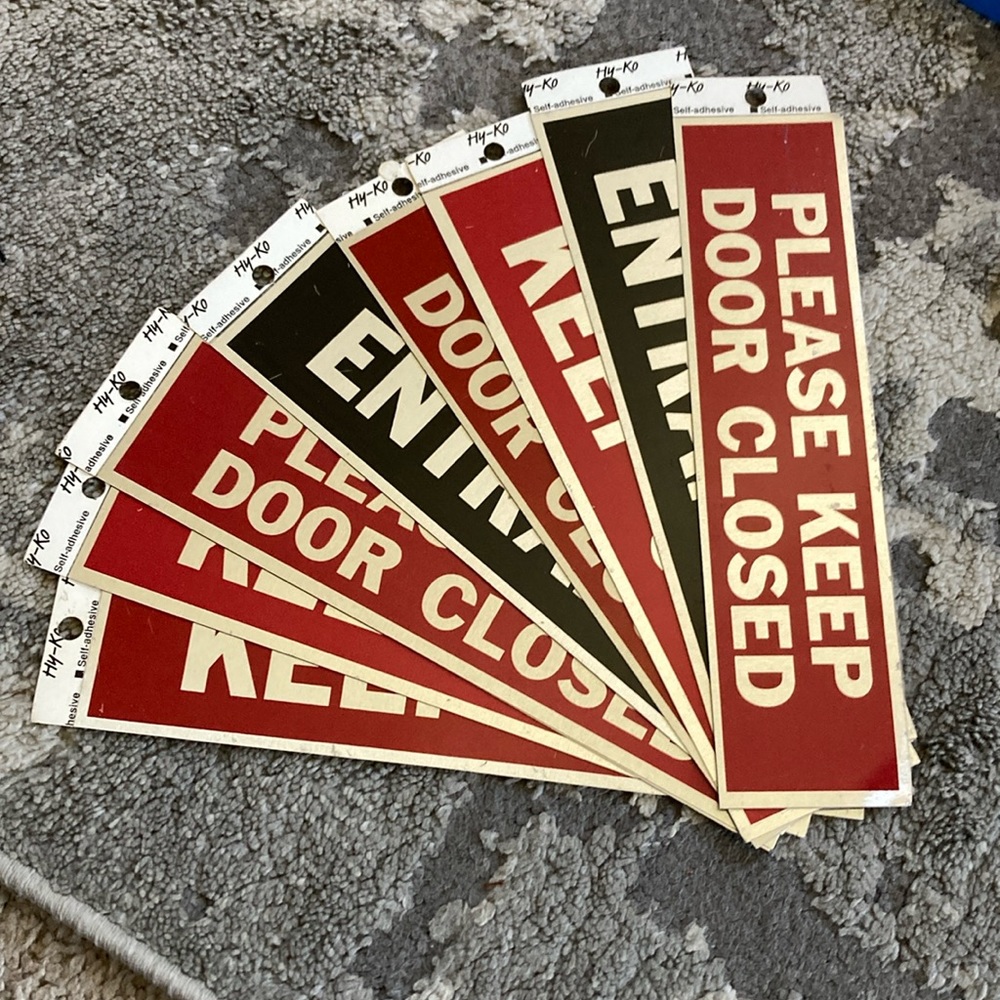 Signs with adhesive
